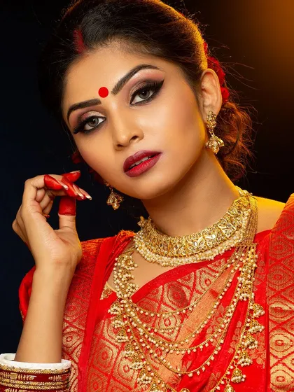Capturing the essence of a Bengali bride. This look is defined by the traditional 'mukut', bold eyes, and the red bindi, all styled and photographed in our studio.