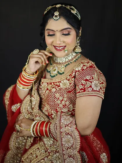 A happy and smiling bride, feeling confident in her reception look. The makeup is designed to last all night while looking fresh and beautiful.