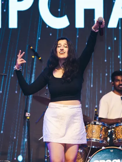 Feeling the music with my amazing drummer holding down the beat. The energy between the band members on stage is what makes our live shows so special.