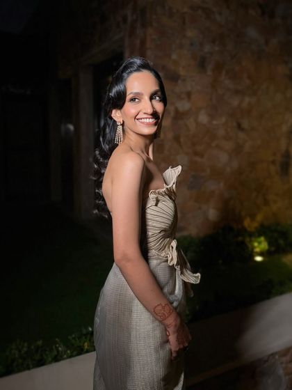 The complete look, showcasing how a vintage inspired hairstyle and a modern outfit can come together for a truly unique and elegant evening style.