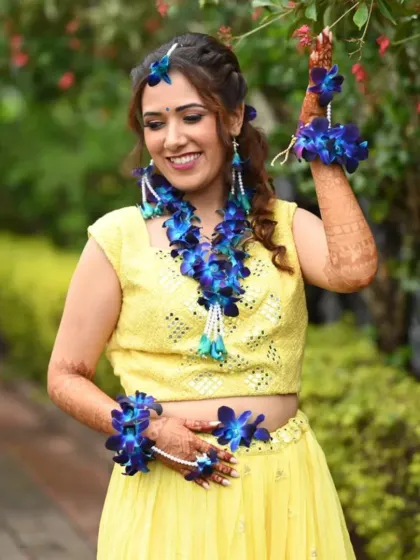 For a bold and unique Haldi look, I created this stunning set using vibrant blue orchids. It's a perfect choice for the bride who wants to make a statement.