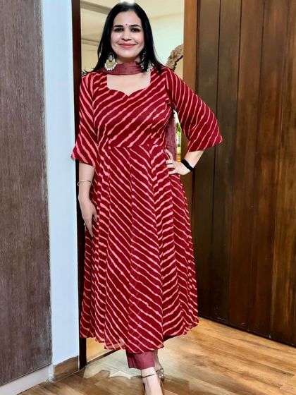This red leheriya print Anarkali is such a vibrant and happy outfit. It's one of my go-to choices for festivals because it's so comfortable and cheerful.