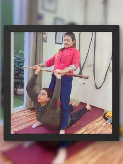 A client testimonial photo showing a student being assisted with a stick in a deep backbend.