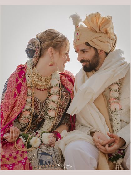 A quiet, loving glance shared between the couple after a playful moment in their ceremony.