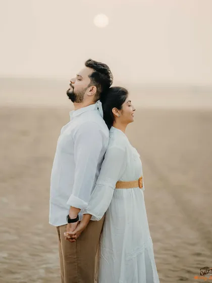 A serene and artistic pose with Milan and Pranali on the beach. This quiet moment of reflection, back to back, creates a powerful and symbolic image.