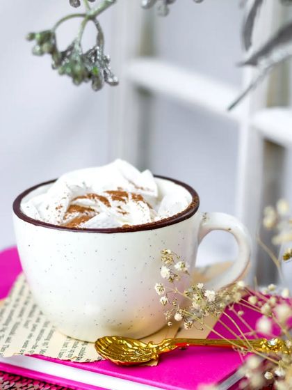 I wanted to capture a moment of pure joy with this personal project. A simple cup of coffee is framed by delicate flowers against a bright window, creating a light and airy winter scene.