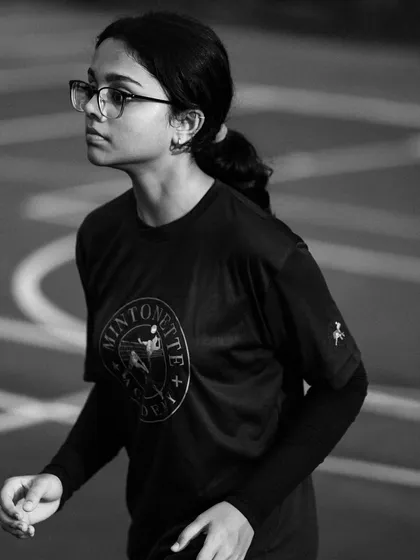 The intense, focused gaze of a player in the middle of a game, captured in a striking black and white portrait.