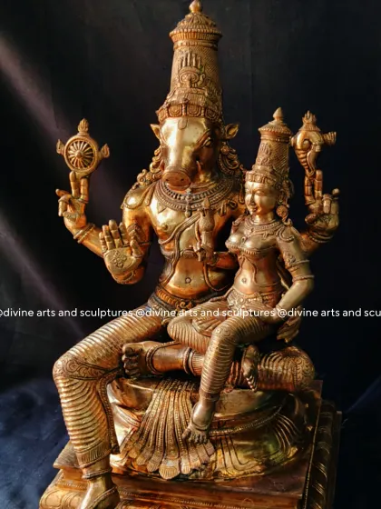 This sculpture of Lakshmi Varahar, Lord Vishnu in his Varaha avatar with Goddess Lakshmi, is a testament to our intricate detailing. The polished bronze finish brings out the divine radiance and blessings of strength and prosperity embodied in this form.