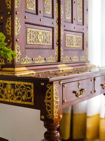 Detail is everything. This traditional wooden cabinet features intricate brass work, adding a touch of royal Indian heritage to a contemporary living room. It’s a functional piece of art that tells a story of craftsmanship.