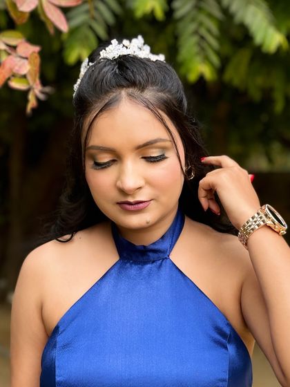 A close-up of the makeup for the blue gown look, showing the shimmery eyeshadow and perfectly defined winged liner.