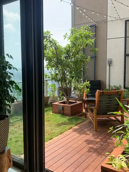 We can turn any terrace into a functional and beautiful outdoor living room. This project features a custom wooden deck, a lush lawn area, and carefully selected trees to create a private escape with a city view.