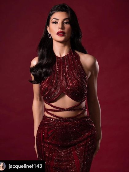 A stunning portrait of Jacqueline Fernandez. Her classic red lip and soft Hollywood waves are the epitome of timeless red carpet glamour. An absolute vision.