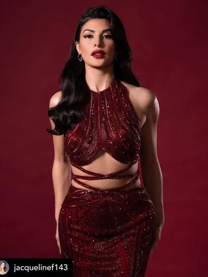 A stunning portrait of Jacqueline Fernandez. Her classic red lip and soft Hollywood waves are the epitome of timeless red carpet glamour. An absolute vision.
