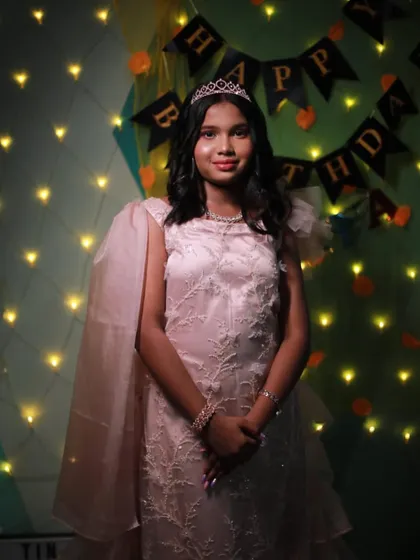 Another shot of the birthday girl, glowing under the party lights.