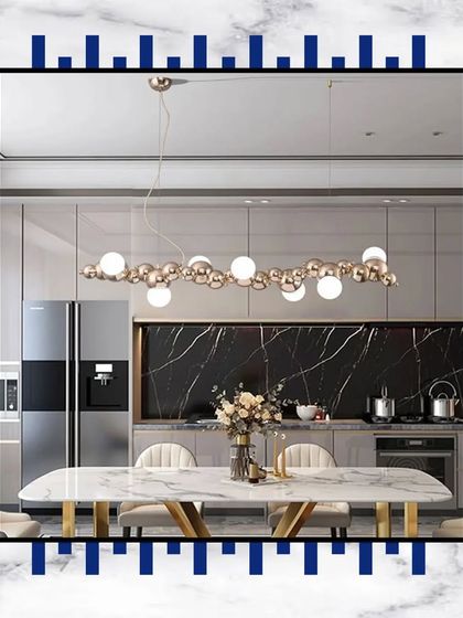 Experience dining in absolute elegance. This design, with its marble-topped table and modern bubble chandelier, encapsulates the essence of luxury.