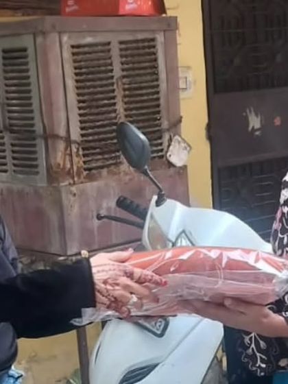 A member of our community donates a warm blanket as part of our winter drive. It's a powerful moment of giving back and ensuring no one is left to face the cold alone.