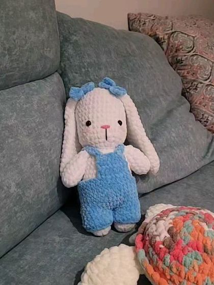 Fluffy the bunny, fully assembled and sitting on a couch. Seeing all the pieces come together to form a complete, cuddly character is the best feeling.