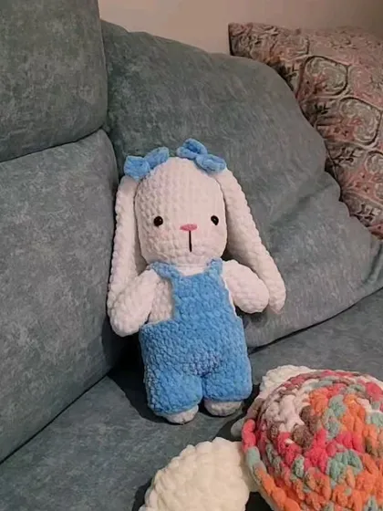Fluffy the bunny, fully assembled and sitting on a couch. Seeing all the pieces come together to form a complete, cuddly character is the best feeling.