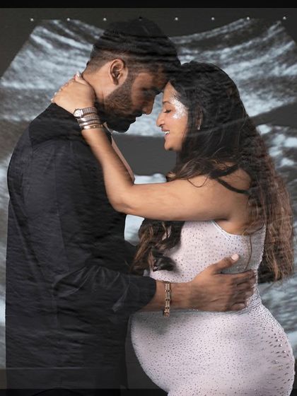 A creative double exposure, blending an intimate couple's portrait with the image of their baby's sonogram.