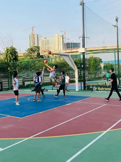 A contested layup shows the intensity of our practice games.