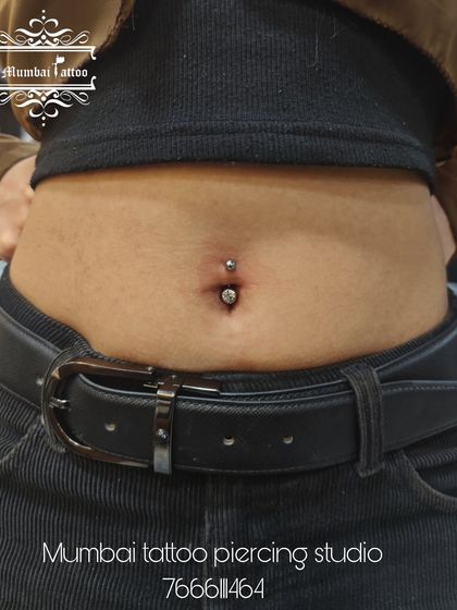 A professionally done belly piercing, looking clean and perfectly centered. We ensure every piercing is 100% safe and hygienic.