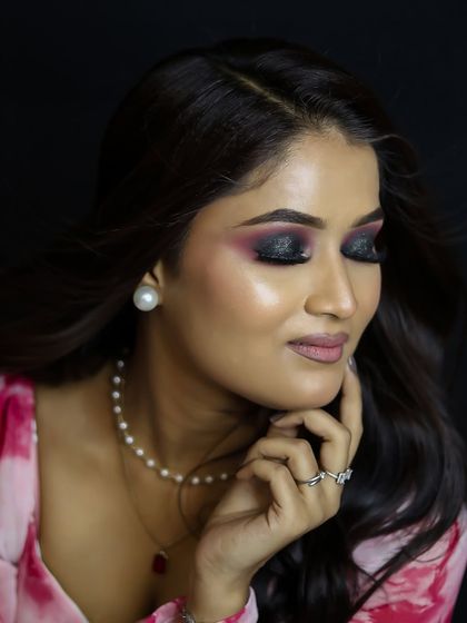 A soft and romantic party look, featuring a black smokey eye and a pink tie-dye dress.