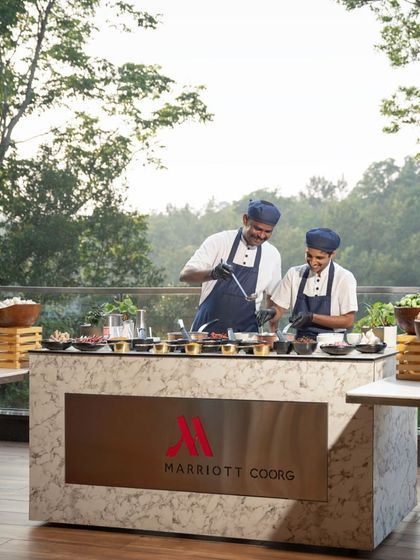Chefs from Marriott Coorg at a live counter, serving up fresh Kodava dishes to our guests. The outdoor setup allowed for an interactive and engaging dining experience.