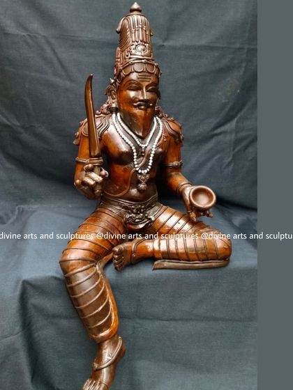 A wax stage sculpture of a Muni, a revered sage. The distinct features, including the beard and seated posture, are carefully crafted to reflect wisdom and penance.