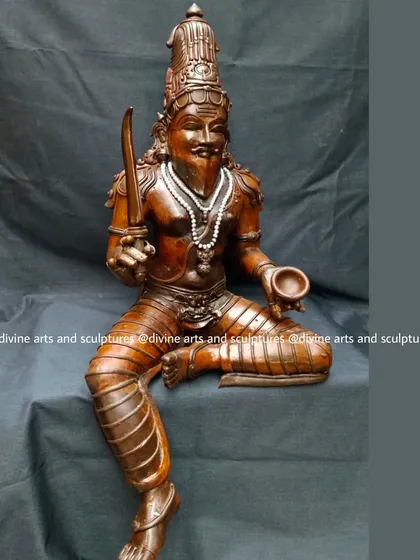 A wax stage sculpture of a Muni, a revered sage. The distinct features, including the beard and seated posture, are carefully crafted to reflect wisdom and penance.