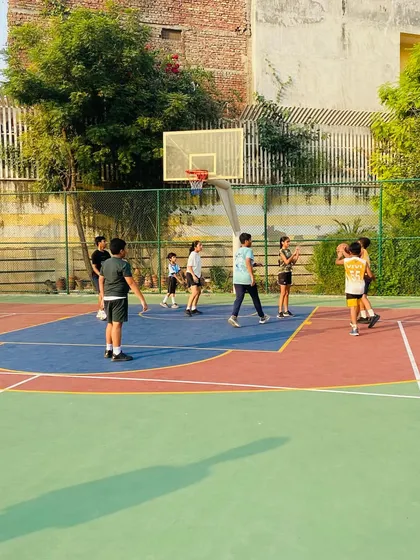 A player looks to pass to a teammate under the basket.