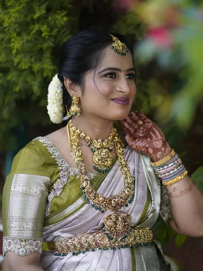 A close-up of Sushma's Seemantham makeup. I focused on soft, smokey eyes and a subtle lip to let her natural beauty and the stunning jewelry shine.