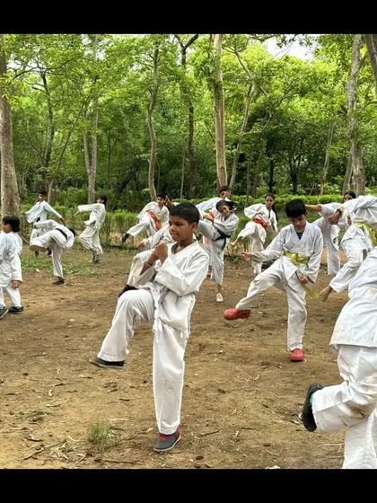 We often take our training outdoors. Practicing karate kicks and forms in the fresh air helps build focus and adaptability, connecting our movements with the world around us.
