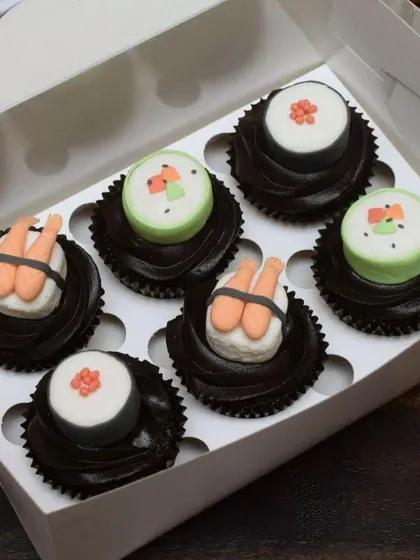 Who says you can't have sushi for dessert? I had a blast creating these quirky sushi-themed cupcakes. Each piece, from the shrimp nigiri to the maki rolls, is handcrafted from fondant and sits on a swirl of rich chocolate frosting.