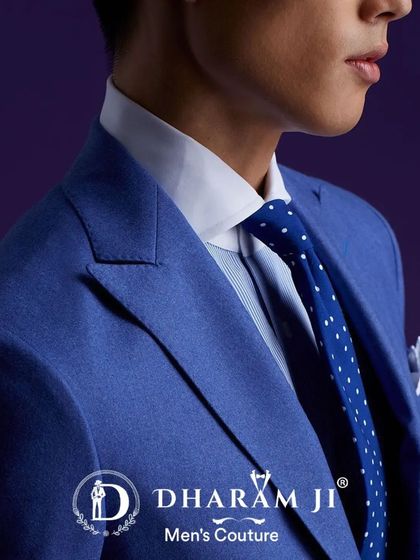 A close-up of a sharp, royal blue suit. The fit across the shoulders and the choice of a contrasting polka-dot tie showcase my attention to detail.