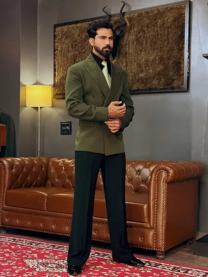 A full-length view of the bottle green blazer, showcasing its modern cut and rich color.