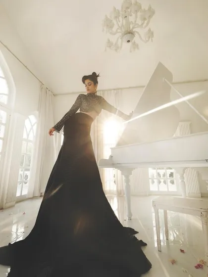 Too glam to give a damn. A dramatic, high-fashion shot of Aaditi Pohankar in a stunning black gown, with makeup to match the elegance.