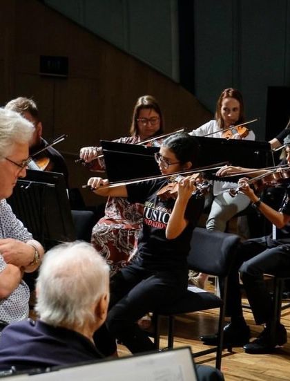 Maestro Zubin Mehta and violinist Pinchas Zukerman observe our Senior String Ensemble during a rehearsal. Learning under the watchful eyes of such legends is a profound and formative experience for our young musicians.