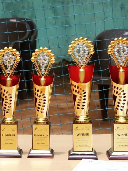 The ultimate prize. These trophies represent the hard work, dedication, and spirit of competition that every player brings to our tournaments. This is what you fight for.