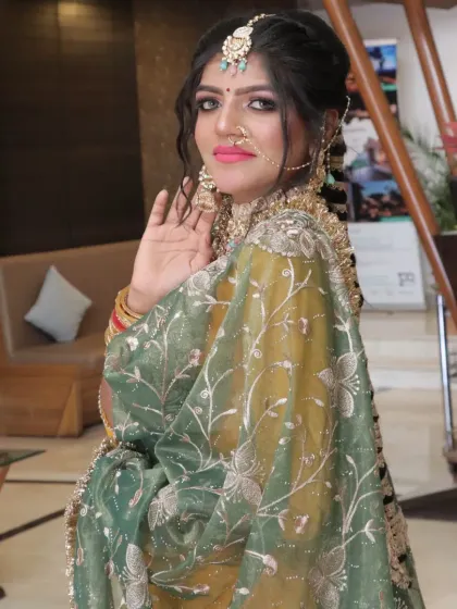 This Punjabi bride's look is all about grace. The soft, smoky eye and the intricately embroidered dupatta are perfectly balanced.