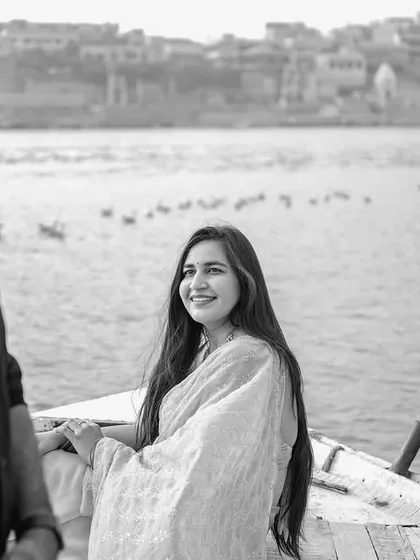 A candid black and white shot capturing a natural smile from the bride-to-be. This photo highlights our ability to capture genuine expressions during a photoshoot.