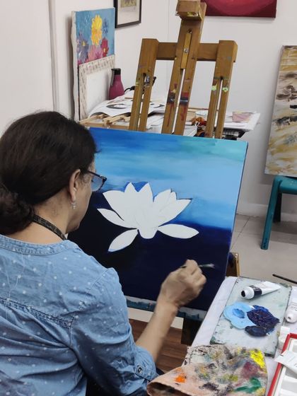 The journey of a lotus painting, from the first strokes of the background to the delicate shading on the petals.