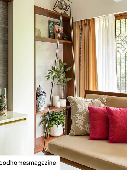 The cozy swing corner in 'Calm Abode', highlighted by Good Homes. We styled it with plush cushions in contrasting colors to make it an inviting spot to relax with a book.