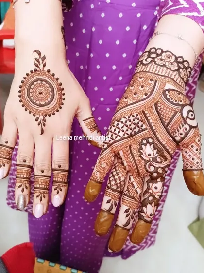 This design shows how two different styles can be used for a single client. One hand has a full, intricate pattern while the other has a simple, elegant mandala.