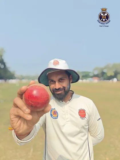 A rare feat by our player-coach. Coach Shreenesh Shah proudly displays the match ball after taking an incredible 10 wickets in a Kanga League match.