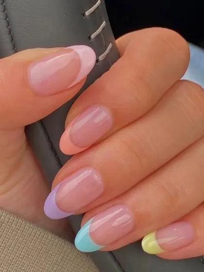 A client's photo of her gorgeous pastel French manicure. Each nail has a different soft-colored tip, creating a fun, rainbow-like effect that's subtle yet incredibly chic.