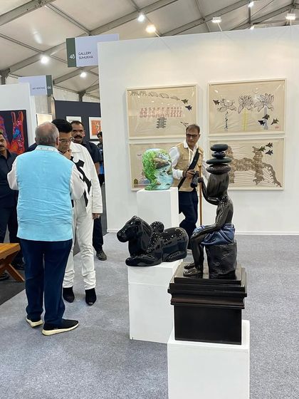 Karan Johar and his entourage viewing the sculptures at our booth.