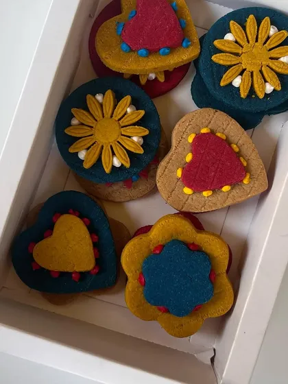 These intricately decorated cookies were created to celebrate a milestone for my bakery. I love designing custom treats for special occasions.