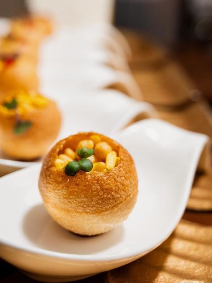 Mini Rajkachori Pop, a deconstructed and modernized version of a classic Indian street food, served as an elegant canapé.