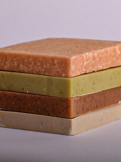 A stack of our Everyday Essentials soaps. This trial pack is a great way to experience four different fragrances and formulas before committing to a full-size bar.