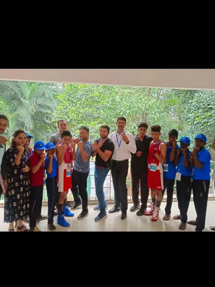 A full-team pose with our fighters in their gear. The energy and team spirit before a competition are a huge part of our training philosophy.
